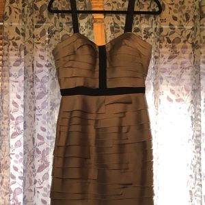 Gold and black sleeveless dress.